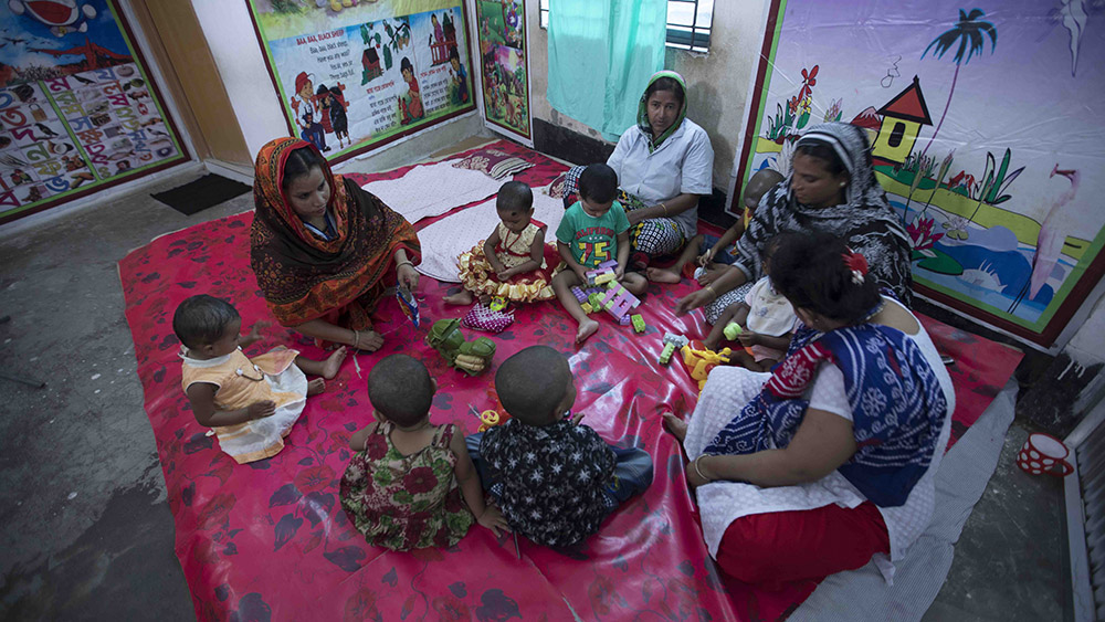 Workers get free childcare in a garment factory in Bangladesh